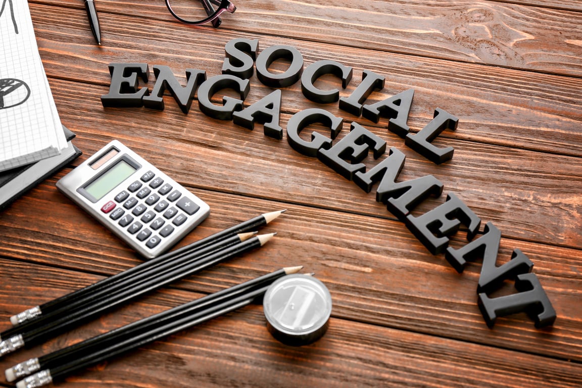 Text SOCIAL ENGAGEMENT Made of Letters on Office Table